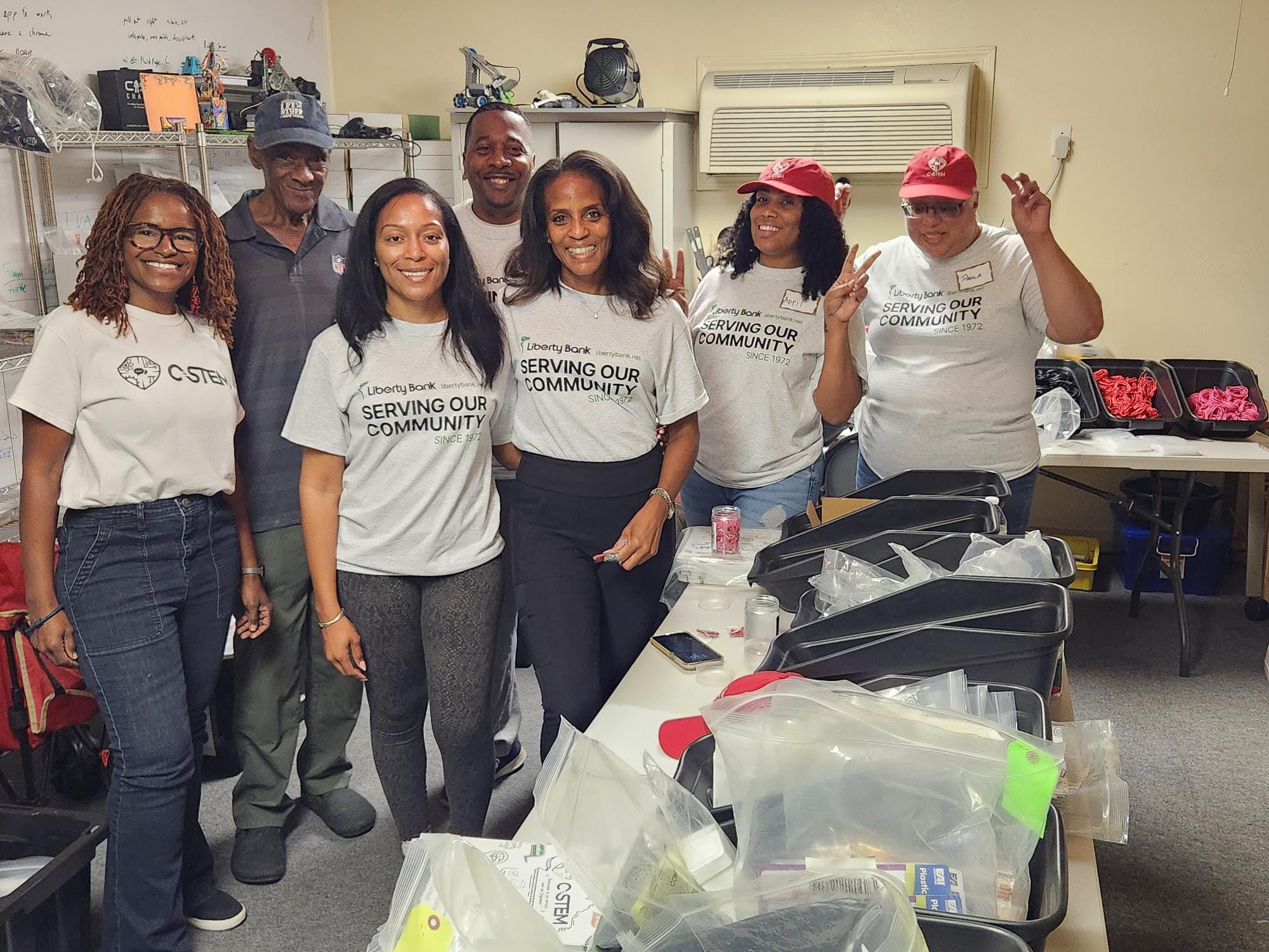 Volunteers in C STEM shirts serve the community with Liberty Bank, since 1972.